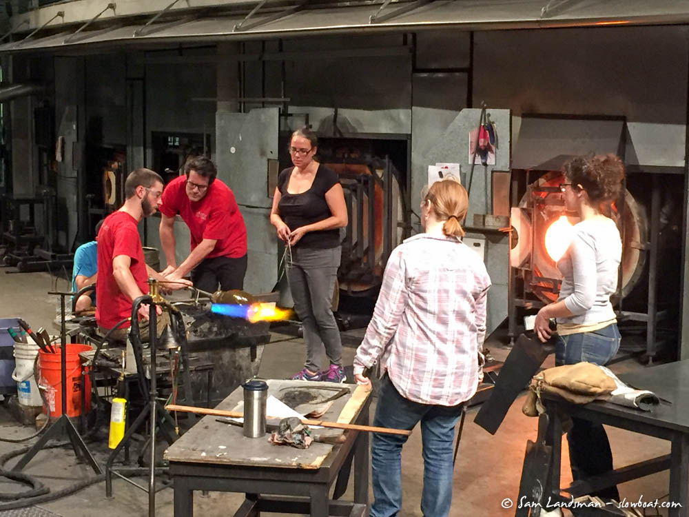 Artists work in the hot shop